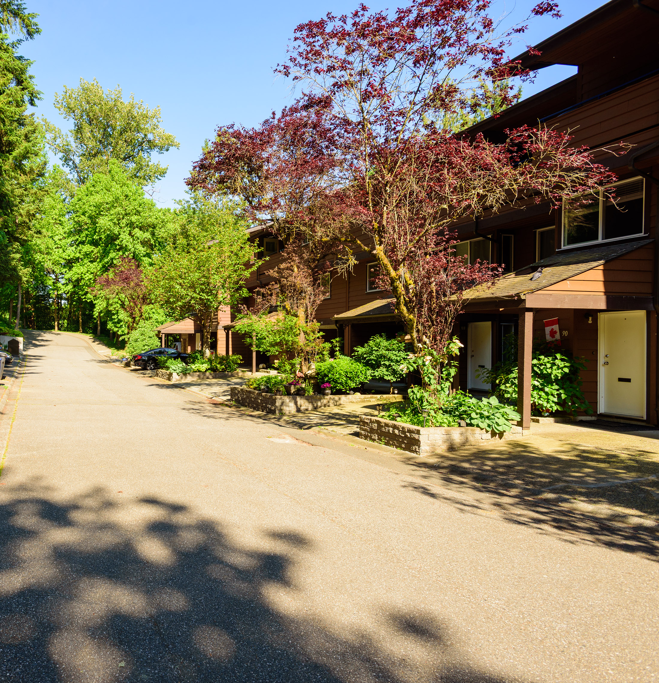 F-block units surrounded by lush greenery